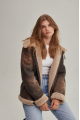 Women's sheepskin coat of brown color in vintage style