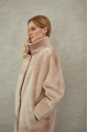 Women's long sheepskin coat made of natural sheepskin, beige color