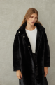 Women's long sheepskin coat made of natural sheepskin, black color