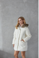 Women's down jacket of white color with a hare fur trim