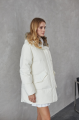 Women's down jacket of white color with a hare fur trim