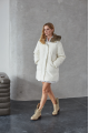 Women's down jacket of white color with a hare fur trim