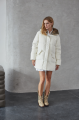 Women's down jacket of white color with a hare fur trim