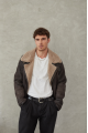 Stylish men's sheepskin coat in VINTAGE style made of natural sheepskin in dark chocolate color