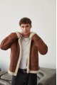 Stylish men's sheepskin coat in the VINTAGE style made of natural sheepskin, whiskey color