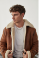 Stylish men's sheepskin coat in the VINTAGE style made of natural sheepskin, whiskey color