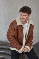 Stylish men's sheepskin coat in the VINTAGE style made of natural sheepskin, whiskey color