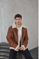 Stylish men's sheepskin coat in the VINTAGE style made of natural sheepskin, whiskey color