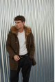 Men's parka of brown color with raccoon fur