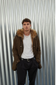 Men's parka of brown color with raccoon fur