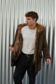 Men's parka of brown color with raccoon fur