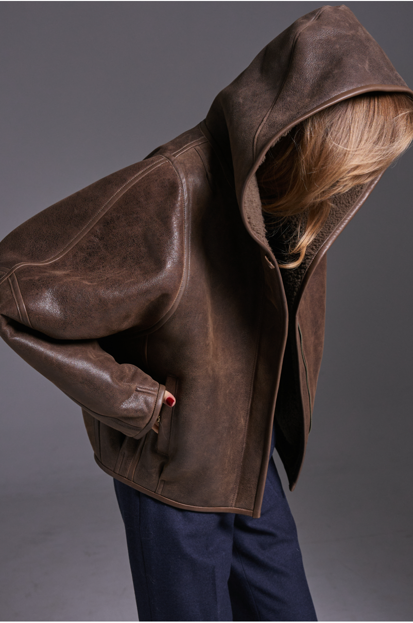 Short chocolate-colored sheepskin coat with a hood made of natural sheepskin