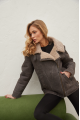 Women's sheepskin coat of gray color in vintage style