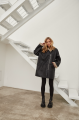 Women's sheepskin coat in VINTAGE style made of natural black sheepskin with beige fur