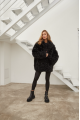 Women's double-sided sheepskin coat of black color made of natural sheepskin