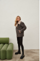 Women's sheepskin coat of gray color in vintage style