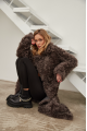 Long two-sided sheepskin coat made of natural sheepskin in coffee color