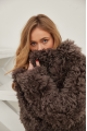 Long two-sided sheepskin coat made of natural sheepskin in coffee color