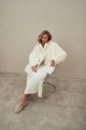 Two-sided white sheepskin coat made of natural cashmere lamb