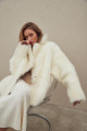 Two-sided white sheepskin coat made of natural cashmere lamb