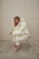 Two-sided white sheepskin coat made of natural cashmere lamb