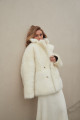 Two-sided white sheepskin coat made of natural cashmere lamb