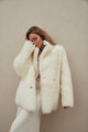 Two-sided white sheepskin coat made of natural cashmere lamb