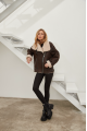 Stylish women's sheepskin coat of chocolate color made of natural sheepskin in VINTAGE style