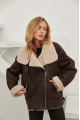 Stylish women's sheepskin coat of chocolate color made of natural sheepskin in VINTAGE style