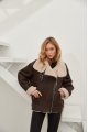 Stylish women's sheepskin coat of chocolate color made of natural sheepskin in VINTAGE style