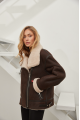 Stylish women's sheepskin coat of chocolate color made of natural sheepskin in VINTAGE style