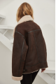 Stylish women's sheepskin coat of chocolate color made of natural sheepskin in VINTAGE style