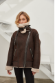 Stylish women's sheepskin coat of chocolate color made of natural sheepskin in VINTAGE style