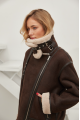 Stylish women's sheepskin coat of chocolate color made of natural sheepskin in VINTAGE style