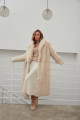 Long sheepskin coat made of natural cashmere lamb in beige color