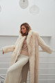 Long sheepskin coat made of natural cashmere lamb in beige color