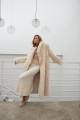 Long sheepskin coat made of natural cashmere lamb in beige color