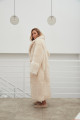 Long sheepskin coat made of natural cashmere lamb in beige color