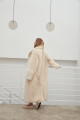 Long sheepskin coat made of natural cashmere lamb in beige color