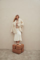 Curly double-sided sheepskin coat of white color made of natural sheepskin in the OVERSIZE style