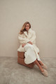 Curly double-sided sheepskin coat of white color made of natural sheepskin in the OVERSIZE style