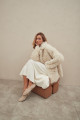 Curly double-sided sheepskin coat of white color made of natural sheepskin in the OVERSIZE style