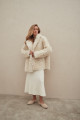 Curly double-sided sheepskin coat of white color made of natural sheepskin in the OVERSIZE style