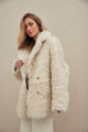 Curly double-sided sheepskin coat of white color made of natural sheepskin in the OVERSIZE style