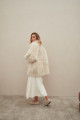 Curly double-sided sheepskin coat of white color made of natural sheepskin in the OVERSIZE style