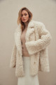 Curly double-sided sheepskin jacket made of natural white sheepskin in OVERSIZE style