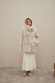 A stylish double-sided sheepskin coat made of natural white sheepskin