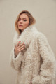 A stylish double-sided sheepskin coat made of natural white sheepskin