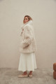 A stylish double-sided sheepskin coat made of natural white sheepskin