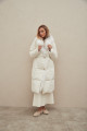 Women's long white down jacket with natural filler and fox fur decoration